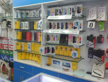 Mobile phone display counter with latest smartphones at Novelty Telecom